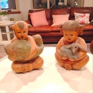 Carved Wood Seated Chinese Figure holding a lamb. Kokeshi style.